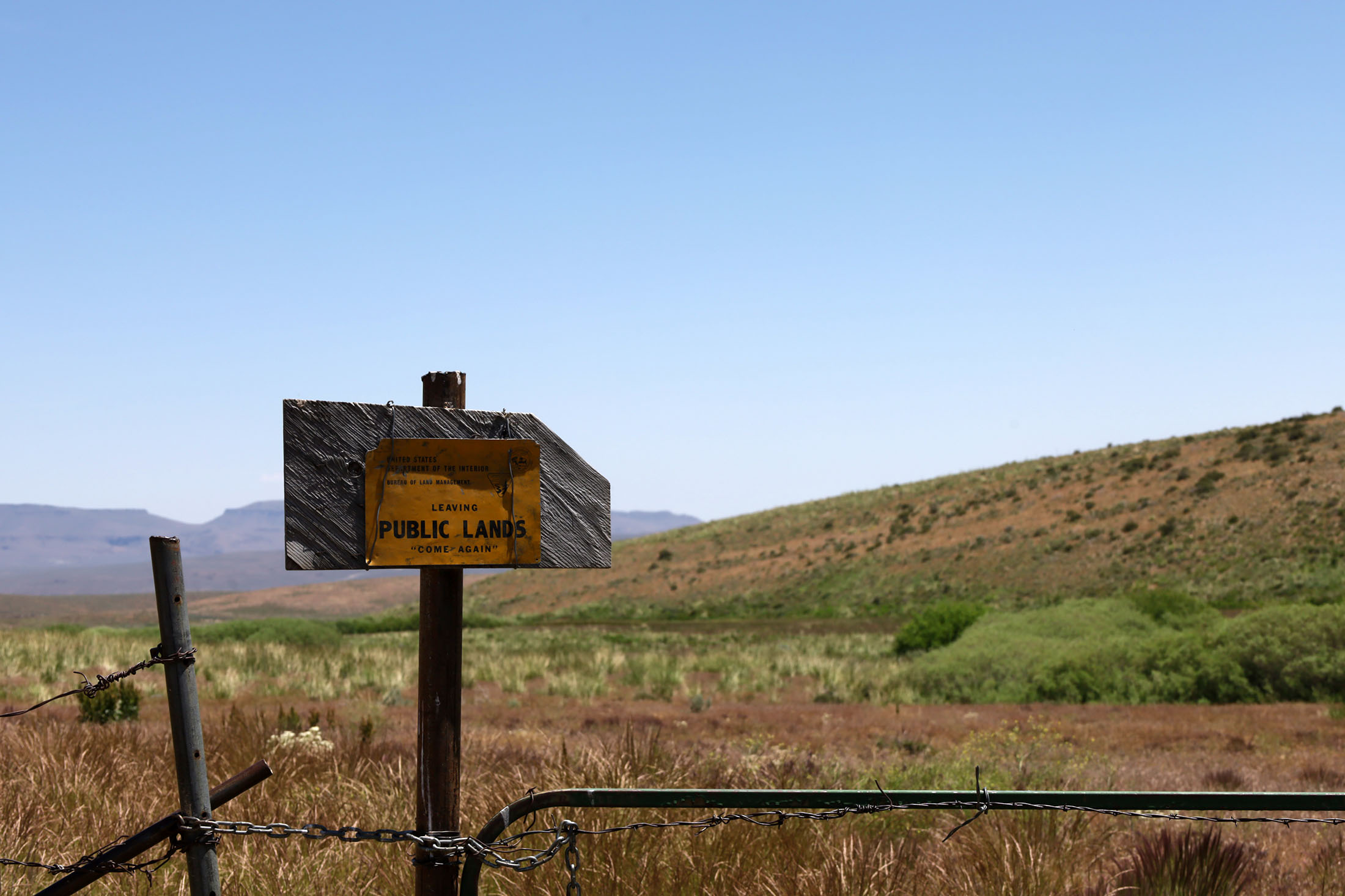 Sign installed by the Bureau of Land Management that reads “Leaving Public Lands.” Photo taken in the caldera by Jose Santacruz.