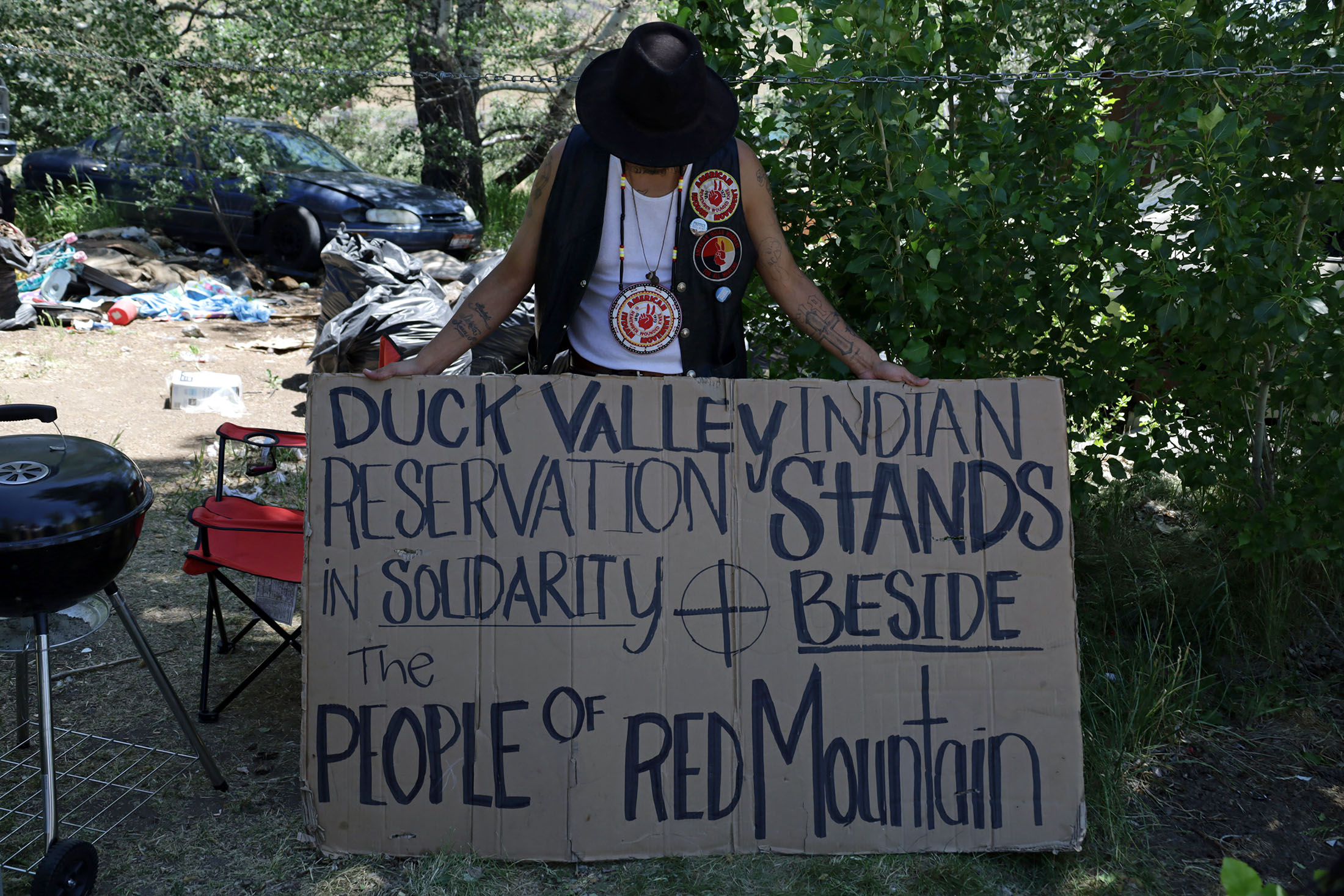 Gary holds the first sign he made to protest the Thacker Pass Lithium Mine. Photo taken in June 2024 by Jessica Ng.