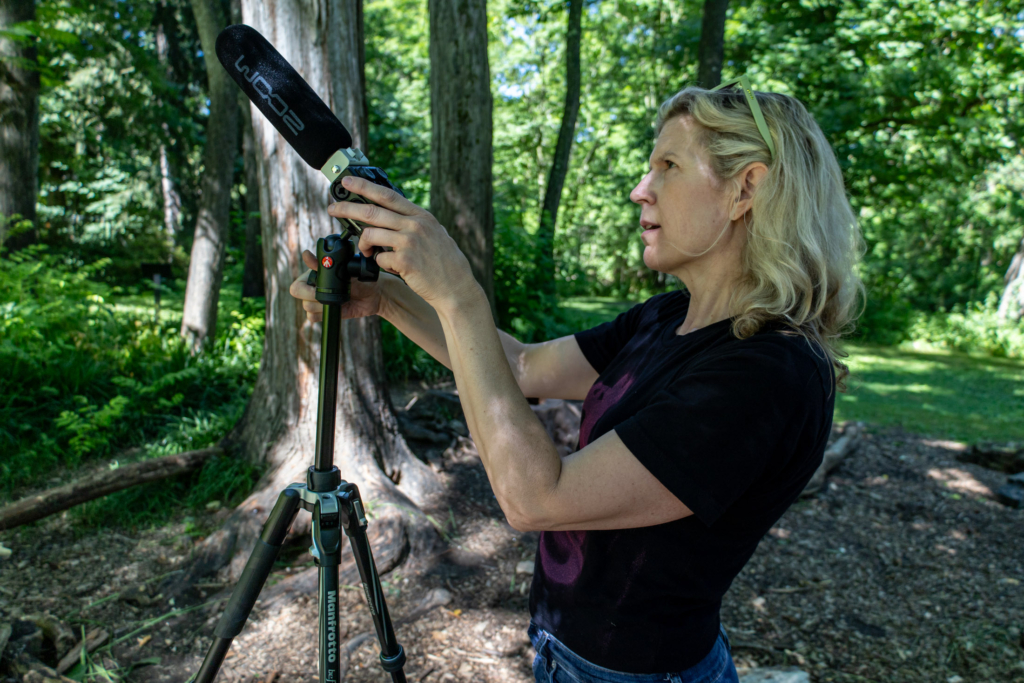 Blue Lab director Allison Carruth sets up the "Tune in to the forest" station.