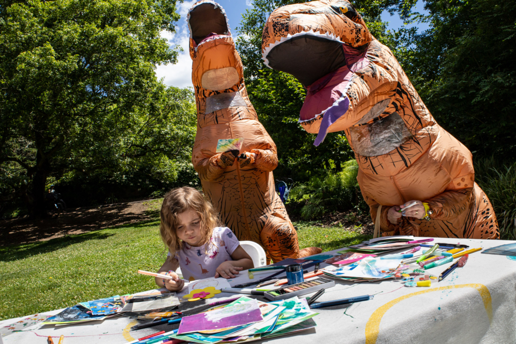 A young visitor to the "Dear wild ones" station at Blue Lab's Popup Story Patch