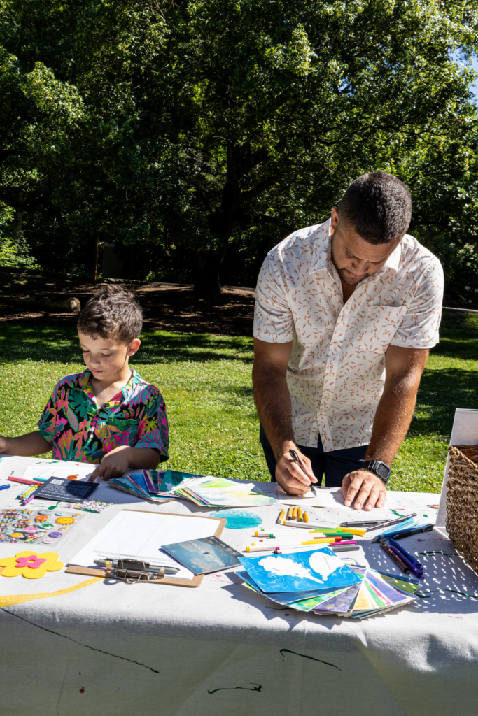 Visitors to the Blue Lab Popup Story Patch at Morris Arboretum.