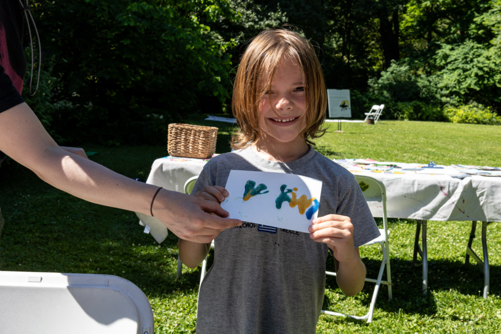 Visitors to the Blue Lab Popup Story Patch at Morris Arboretum