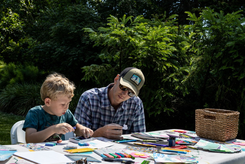 Visitors to the Blue Lab Popup Story Patch at Morris Arboretum.