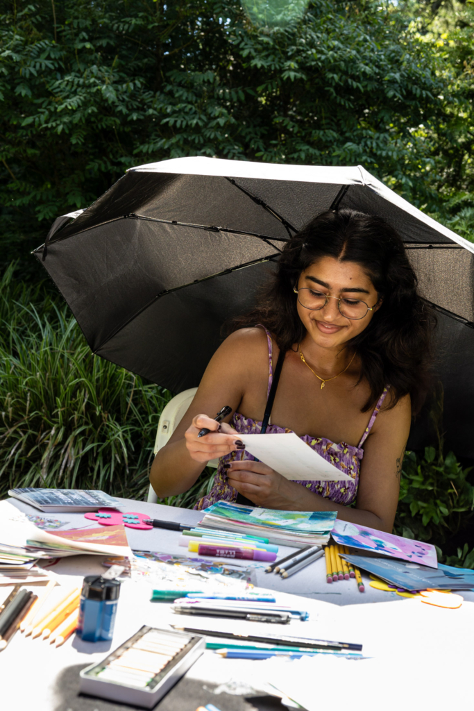 Visitors to the Blue Lab Popup Story Patch at Morris Arboretum.