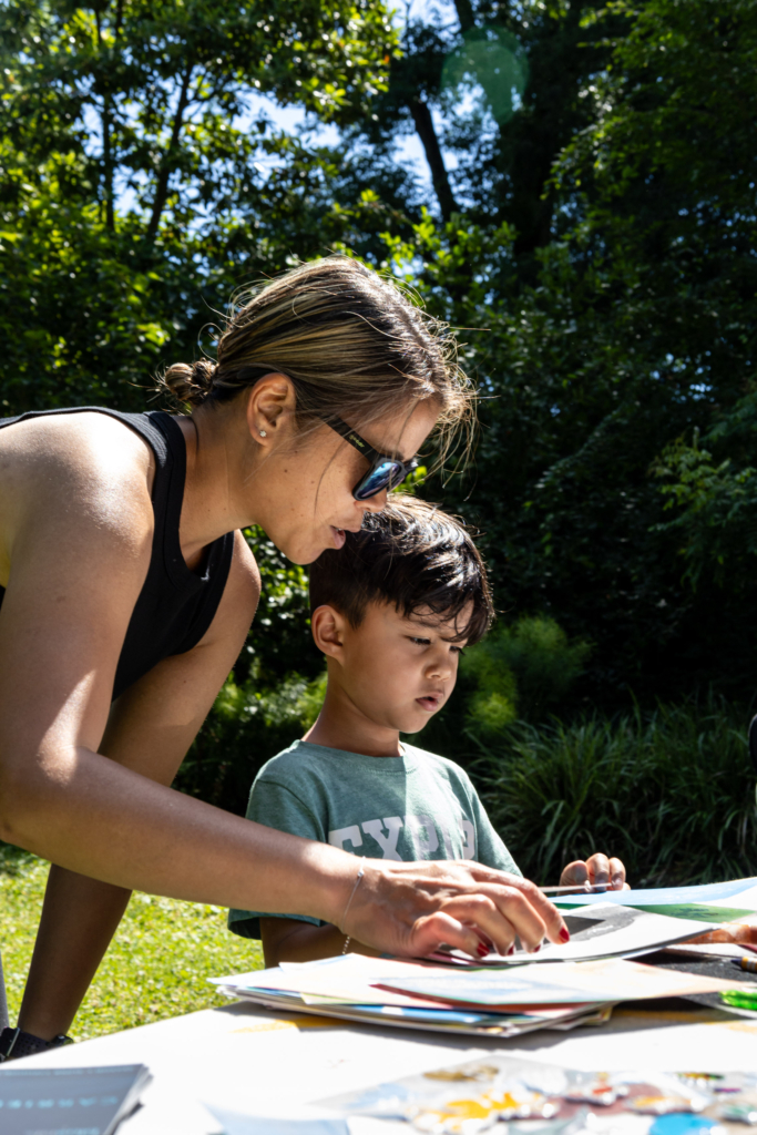 Visitors to the Blue Lab Popup Story Patch at Morris Arboretum.