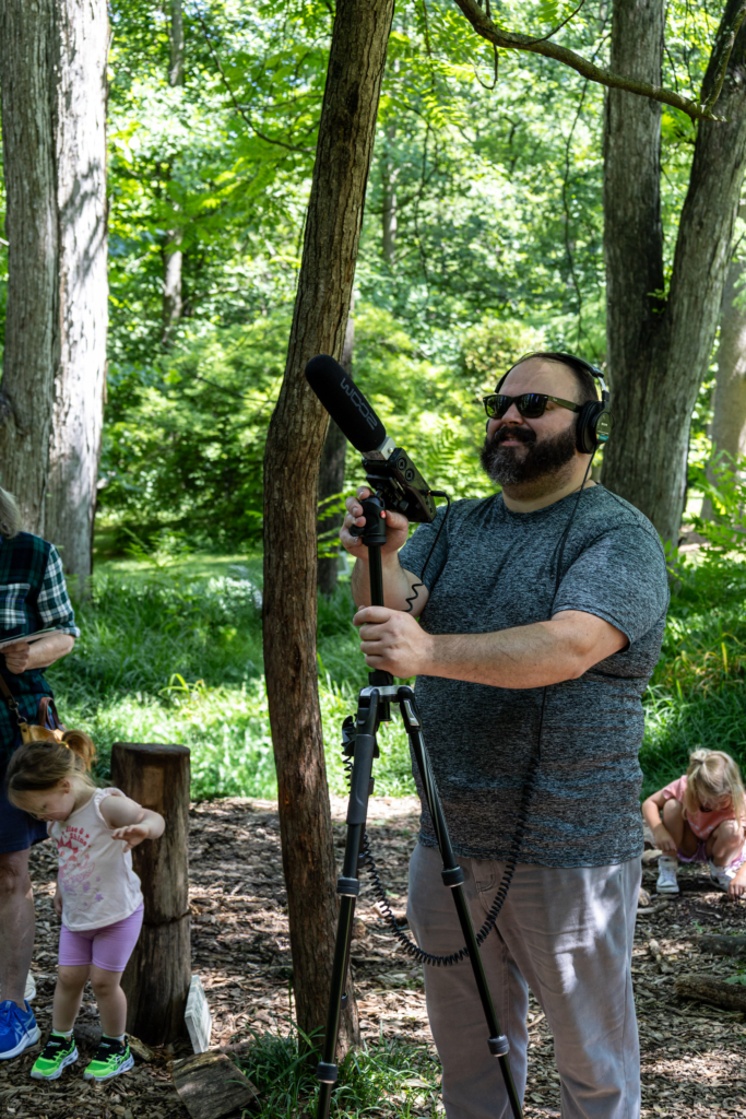 Visitors to the Blue Lab Popup Story Patch at Morris Arboretum.