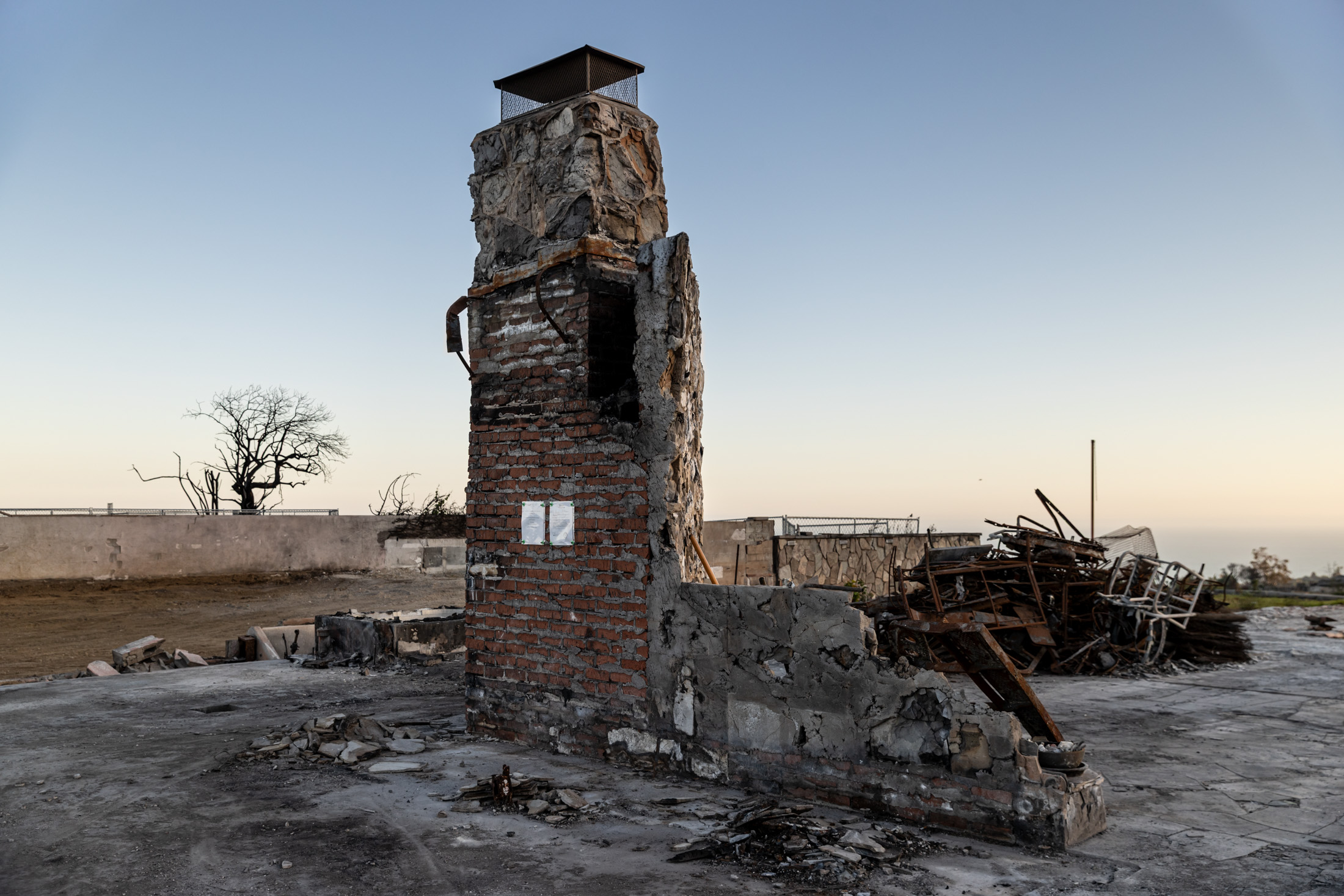 A chimney left standing in a home destroyed in the Palisades Fire