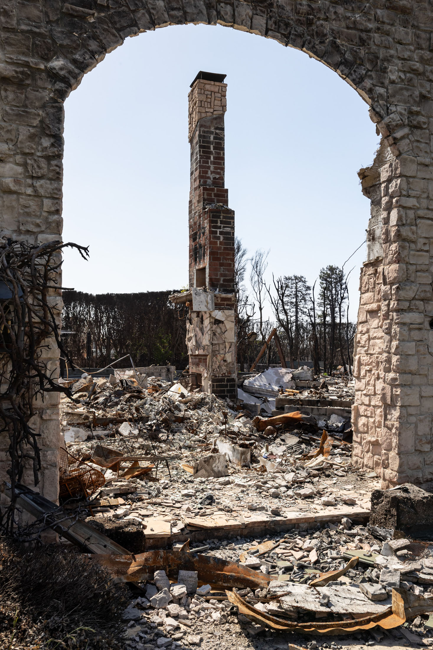 A chimney still standing in the aftermath of the Palisades Fire