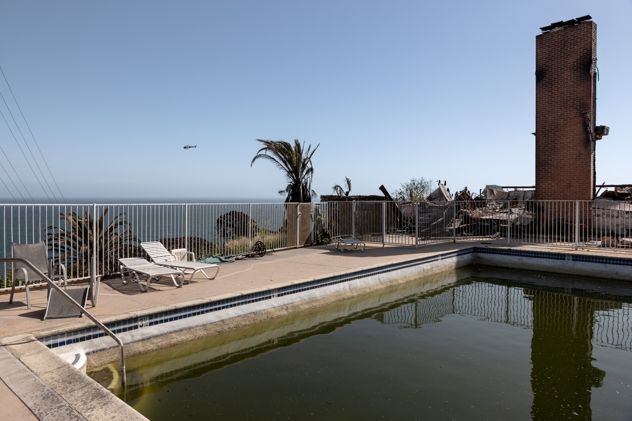 A hotel and pool destroyed in the Palisades Fire